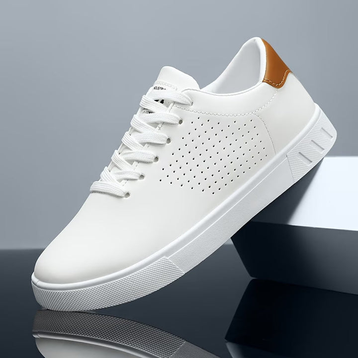 Versatile men's low-top sneakers in crisp white, ideal for a clean, comfortable, and timeless fashion look.