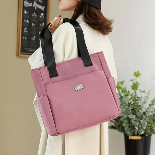 Everyday women's shoulder bag, lightweight & waterproof. Stylish and practical for daily use.