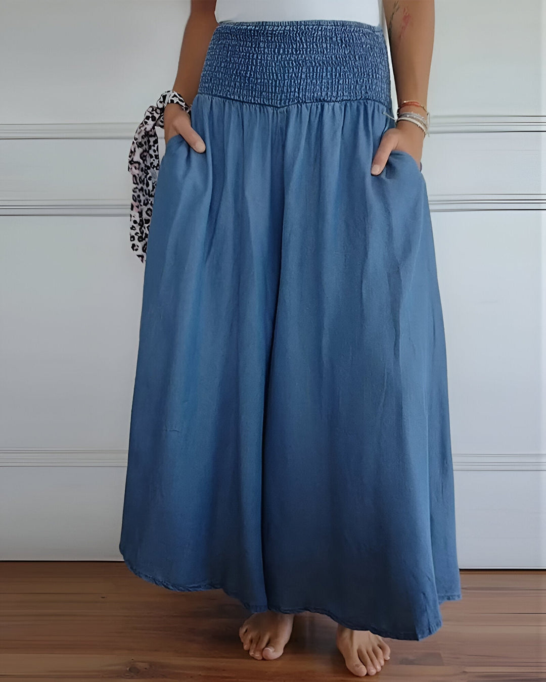 Women's flowy smocked maxi skirt with practical side pockets. Perfect for summer and spring style.