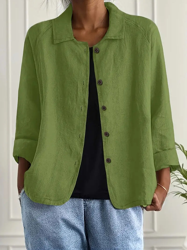 Professional women's collared blouse, button-down front & three-quarter sleeves for work or events.