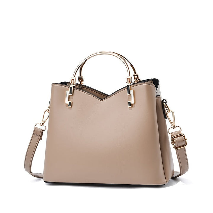 Chic black genuine leather handbag, a stylish and versatile everyday fashion accessory.