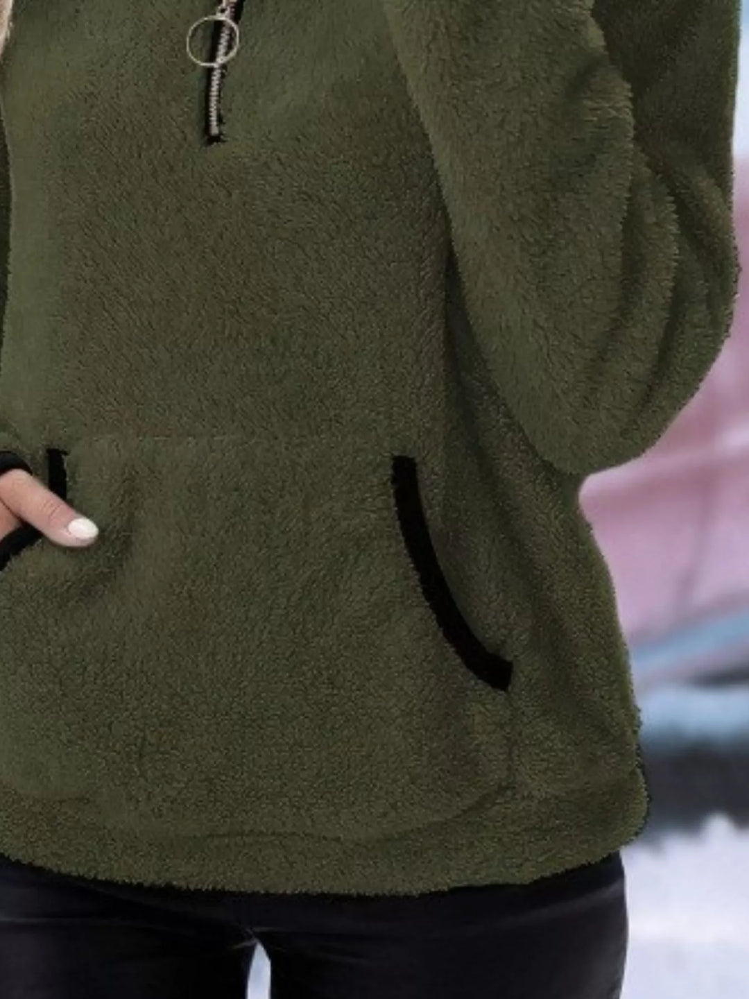 Warm women's half-zip pullover, offering cozy comfort in a relaxed fit.