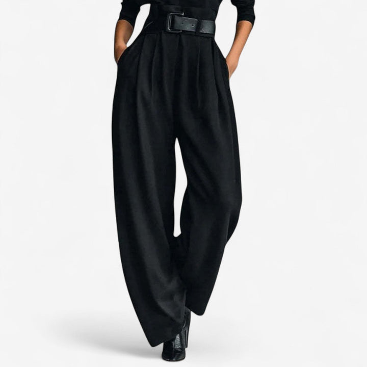 Modern women's high-neck wide-leg jumpsuit in grey, offering effortless style for formal or casual wear.