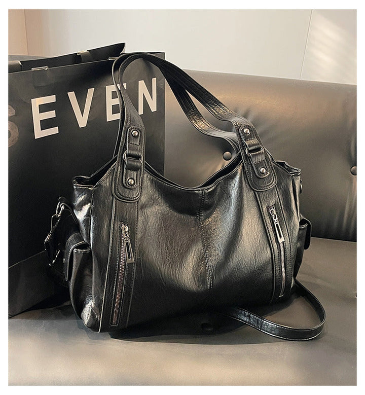 Women's modern faux leather shoulder bag, an everyday tote handbag combining style and utility.