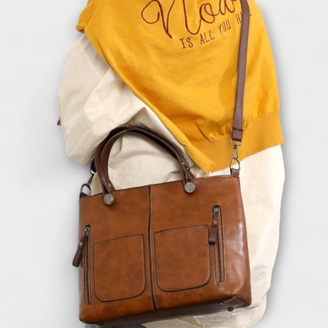 Classic black leather shoulder bag for women, elegant and durable; an essential fashion accessory.