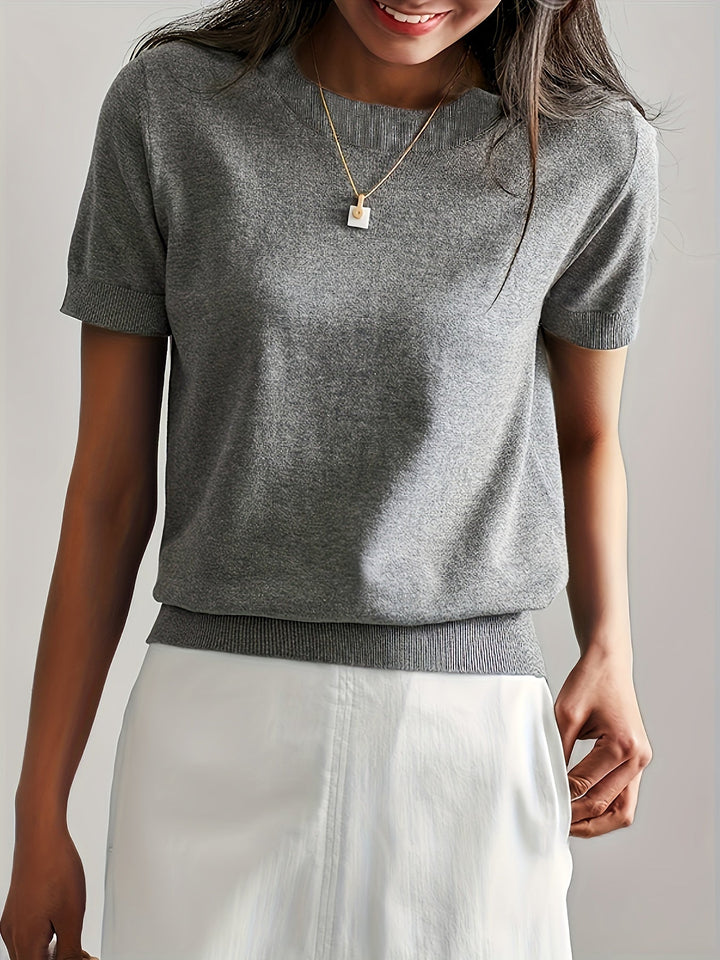 Green women's short sleeve knit top, soft & comfy, versatile for all-season elegant casual style.