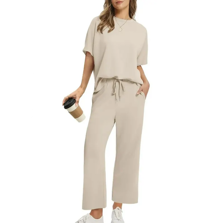 Women's relaxed ribbed two-piece set, featuring a round neck half-sleeve top and comfortable ankle trousers, ideal for loungewear.