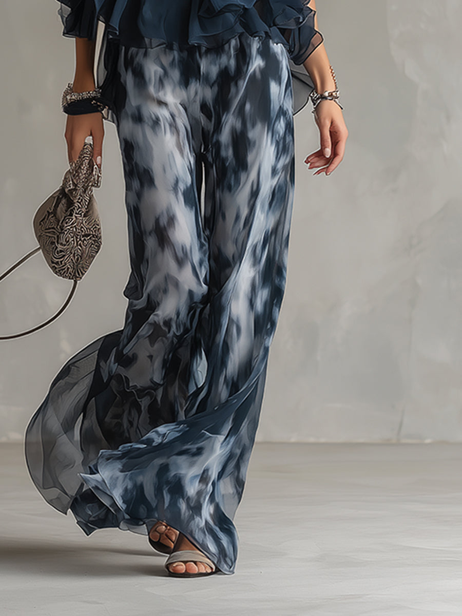 Stylish navy blue women's two-piece outfit with a chic turtleneck top and flowy wide-leg trousers. Modern & elegant.