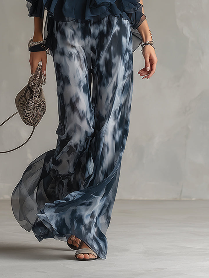 Stylish navy blue women's two-piece outfit with a chic turtleneck top and flowy wide-leg trousers. Modern & elegant.