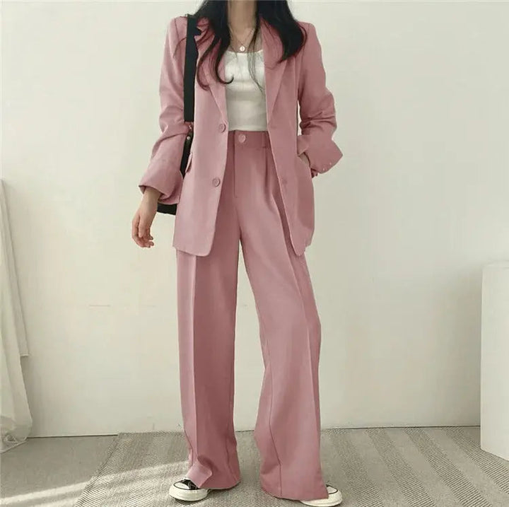 Professional women's blazer & trouser set, exuding sophisticated tailored fashion.