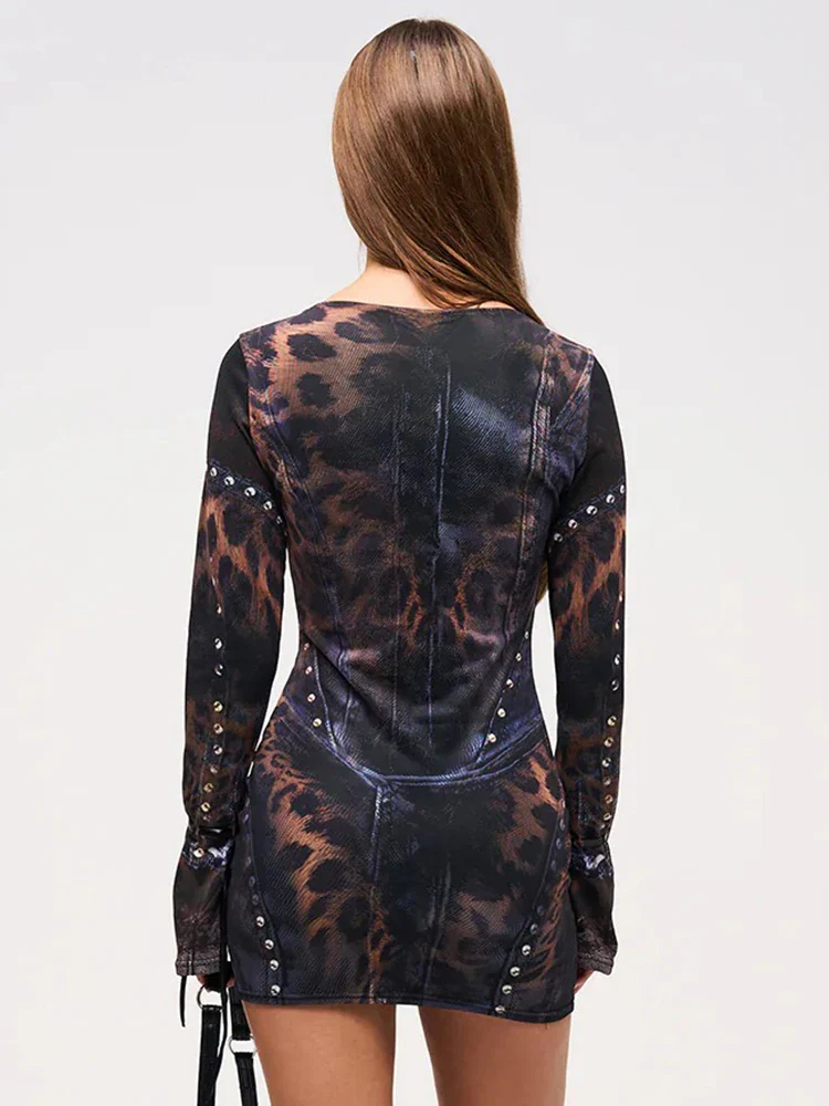 Statement women's gothic mini dress featuring bold leopard gradient print & long sleeves. Edgy above-knee party wear.