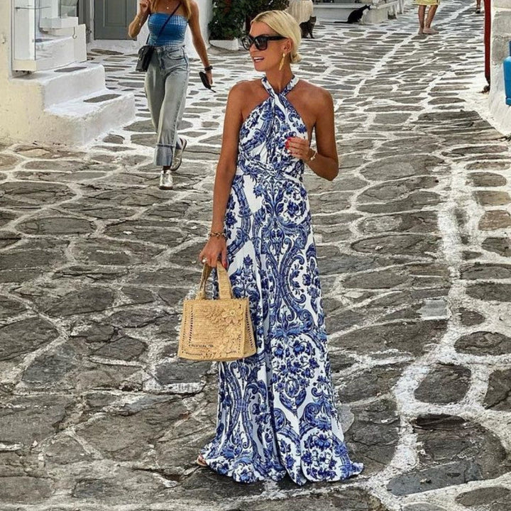 Blue women's elegant halter neck A-line maxi sundress, perfect flowy summer beach dress style.