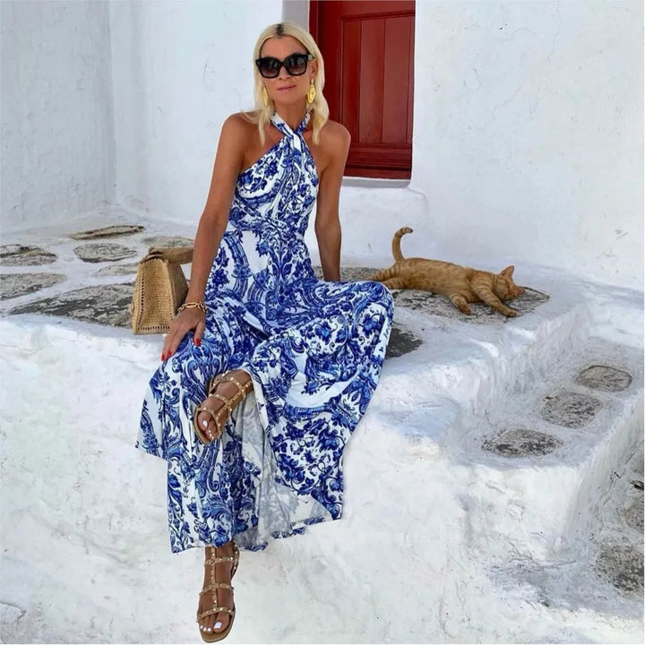 Flowy women's A-line halter maxi dress in blue, ideal elegant summer fashion for beach or casual.
