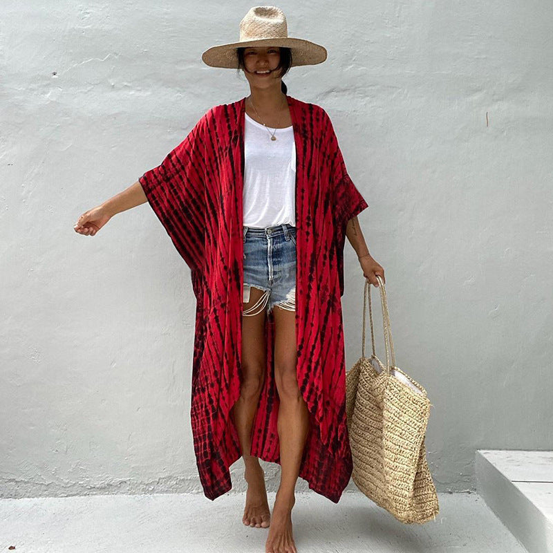Flowy one-size women's swimsuit cover, elegant sun protection beachwear for sunny adventures.