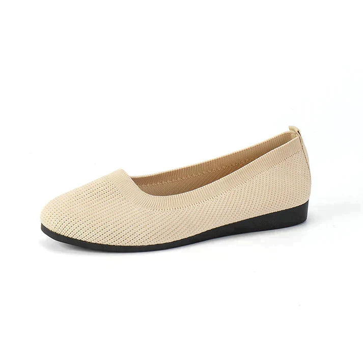 Side view of a comfortable women's orthopedic flat, designed for optimal foot support & elegant style.