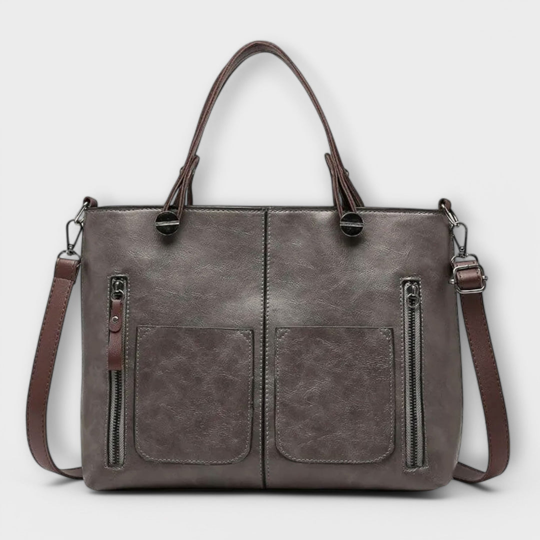 Versatile women's black leather shoulder bag, a timeless fashion accessory for daily elegance.