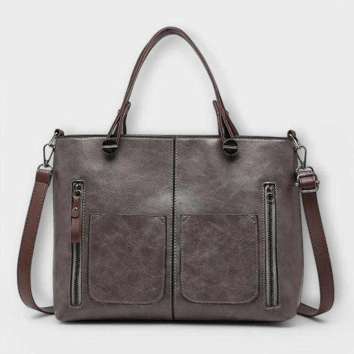 Versatile women's black leather shoulder bag, a timeless fashion accessory for daily elegance.