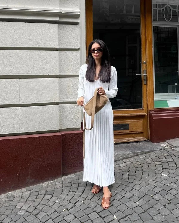 Black chic long sleeve midi dress. Stylish women's clothing, suitable for fall office fashion.