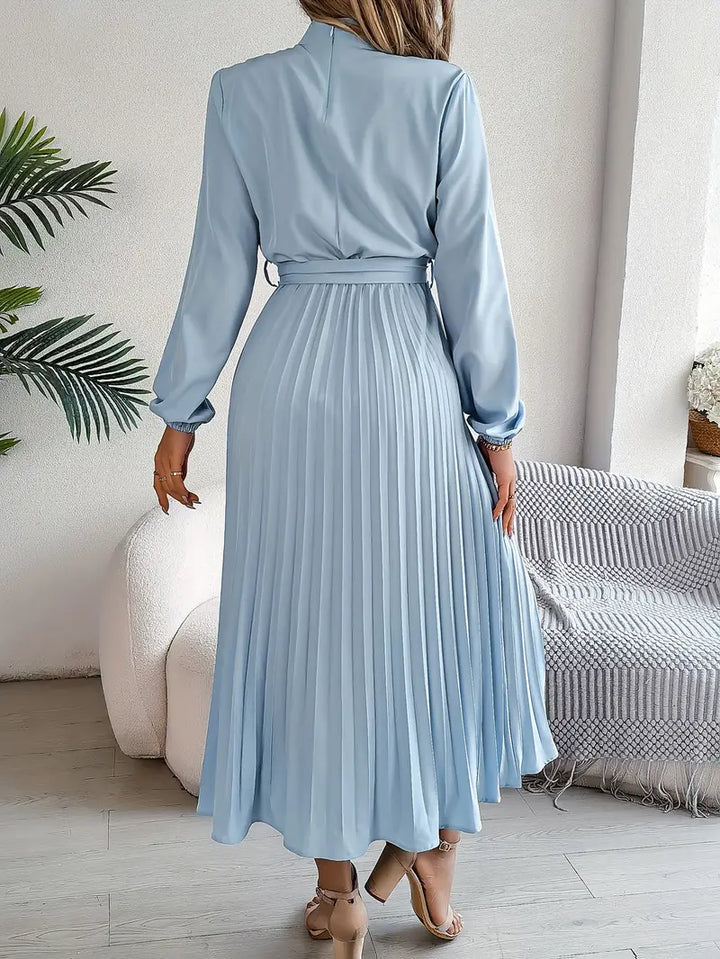 Classic pleated midi dress for women, with long sleeves and a stylish belt.