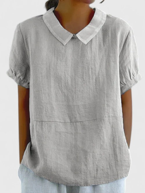 Elegant button-down women's shirt for timeless style, versatile office wear & casual chic.