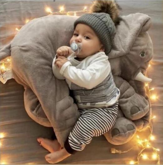 Soft plush elephant cuddle pillow for babies, comfortable & gentle, perfect for snuggling.