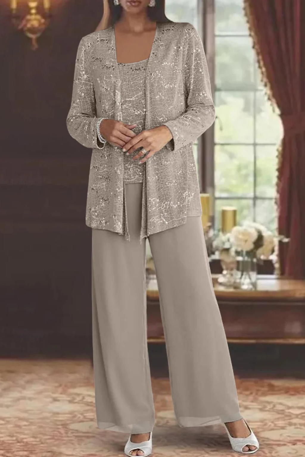 Formal occasion wear: sequined lace women's trouser suit with elegant wide-leg pants.