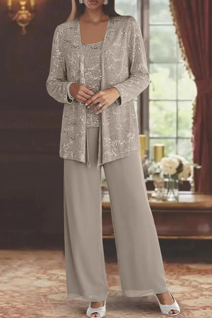 Formal occasion wear: sequined lace women's trouser suit with elegant wide-leg pants.