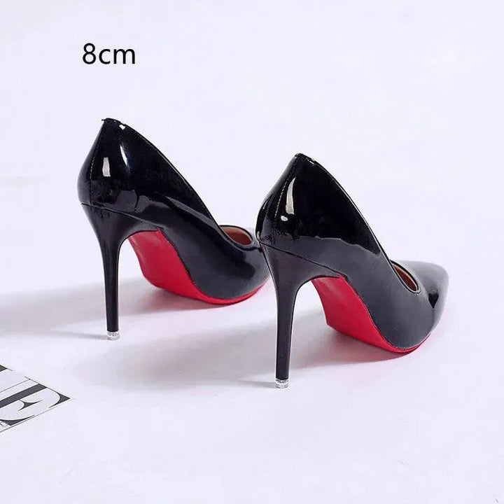 Elegant women's stiletto pumps, sleek design for versatile chic style and formal occasions.
