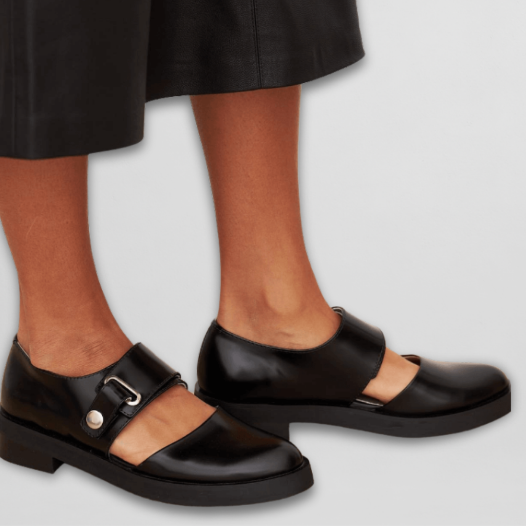 Elegant black women's strap shoes with a comfortable low heel, perfect for classic office or evening wear.