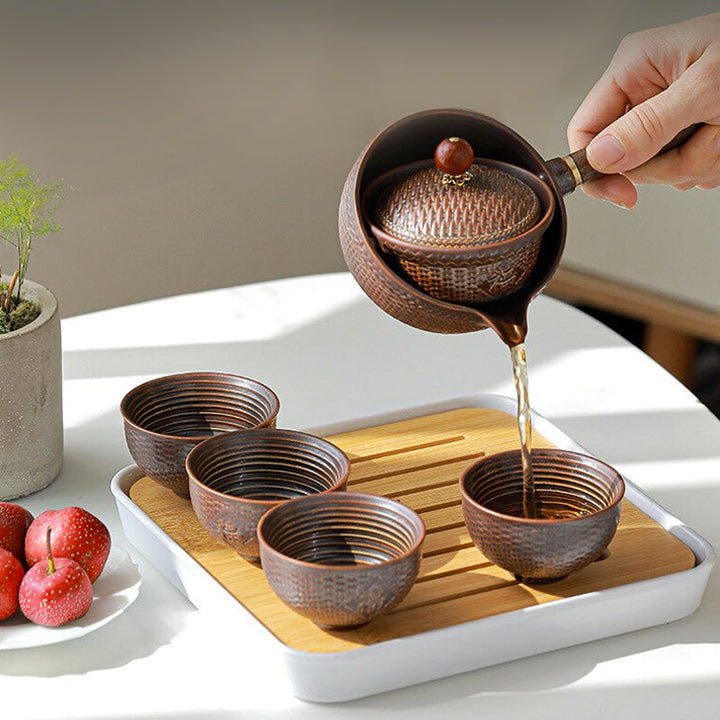 "Elegant ceramic rotating Japanese tea pot set with infuser, showcasing handcrafted artistry and traditional design in blue."