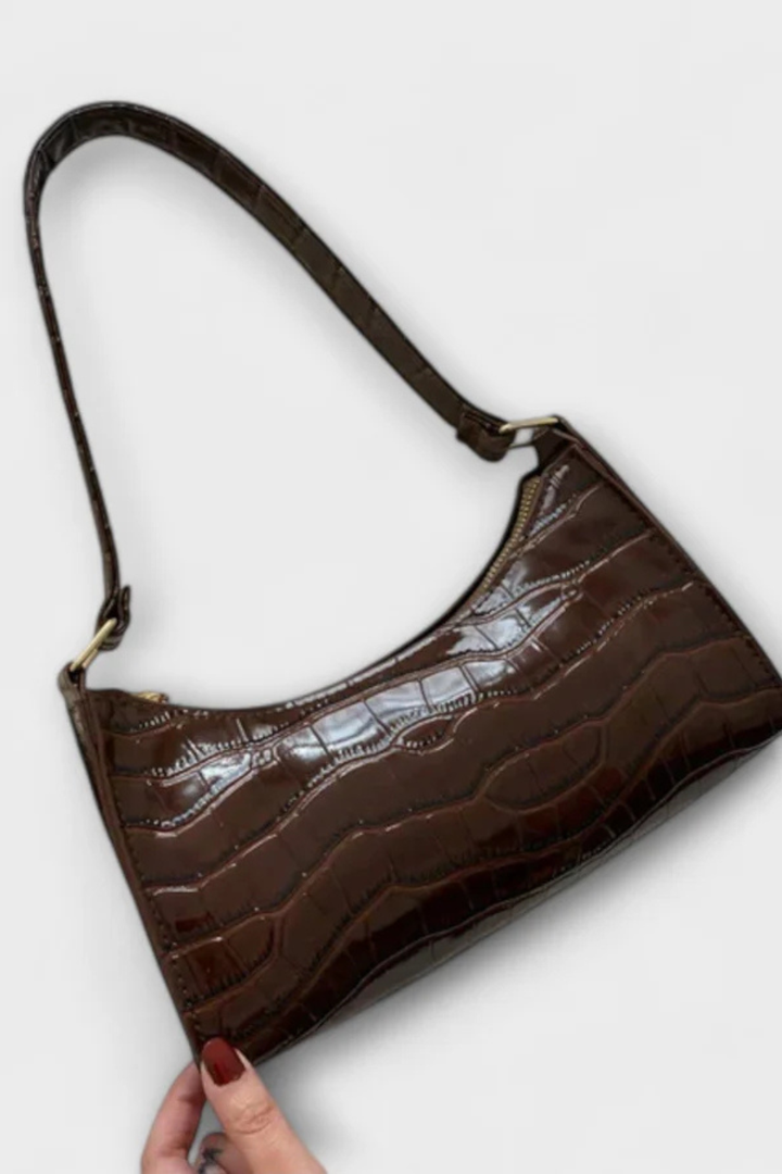 White elegant textured shoulder bag, a clean and classic fashion accessory.