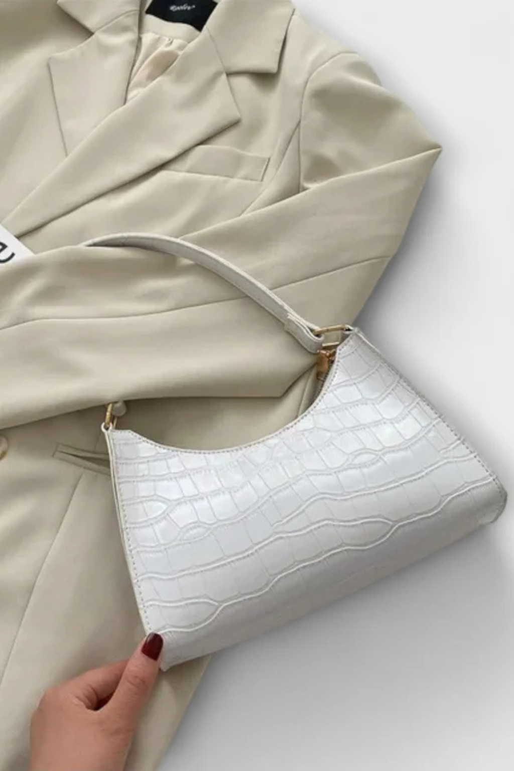 Close-up of the elegant classic textured detail on the women's shoulder bag.