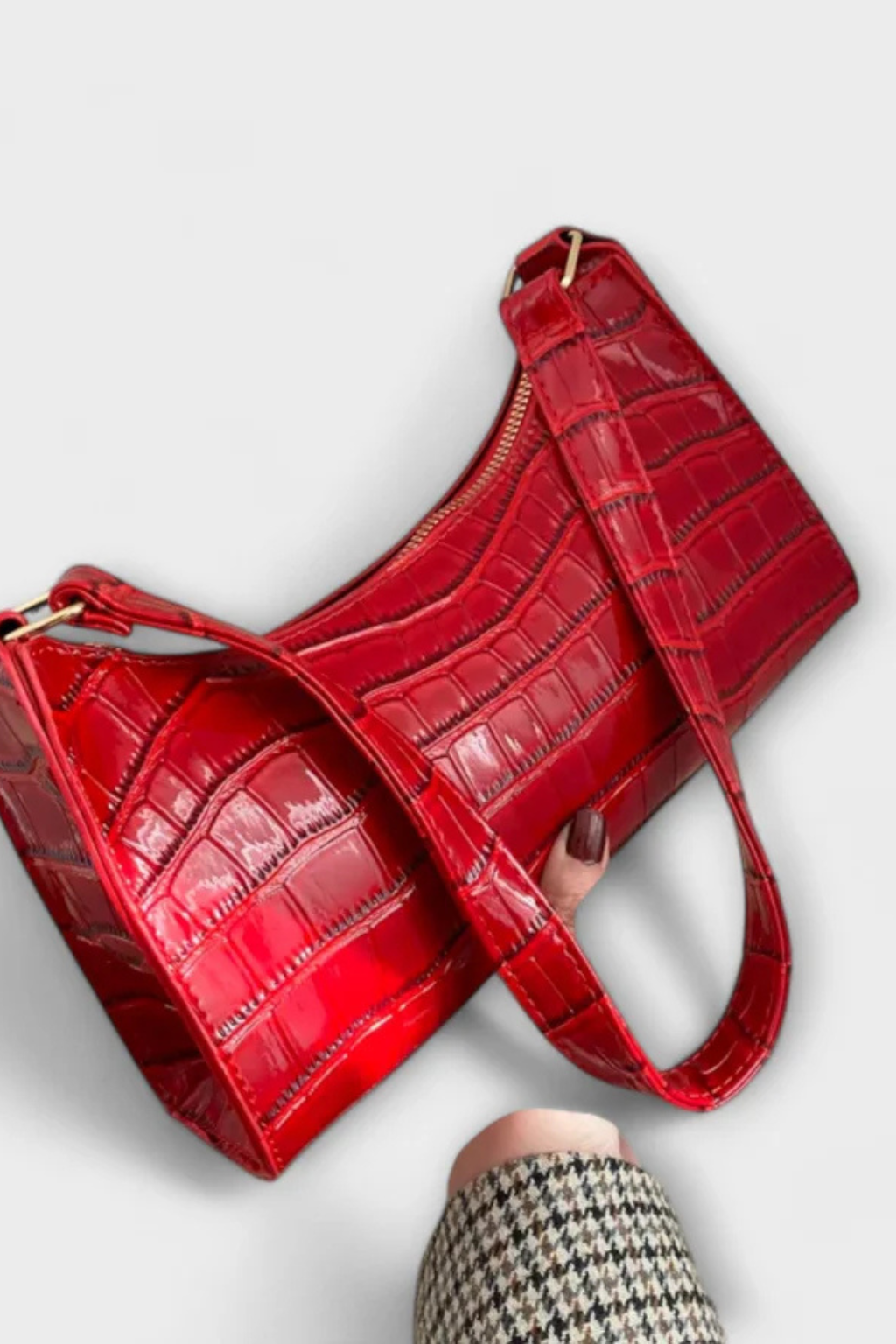 Fuchsia textured women's shoulder bag, a fashionable and elegant statement piece.