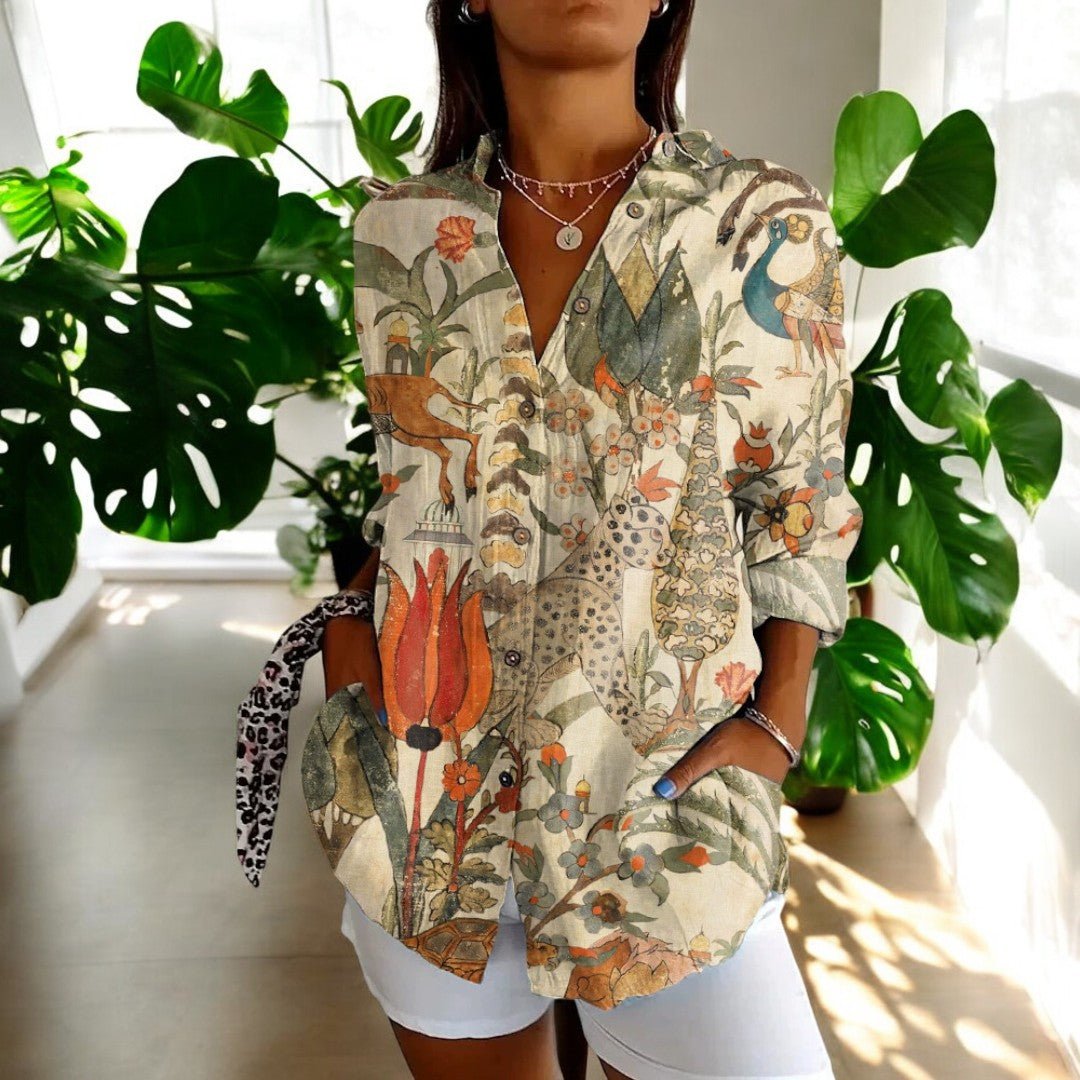 Comfortable women's vintage blouse with an elegant floral pattern. A classic and versatile fashion staple.