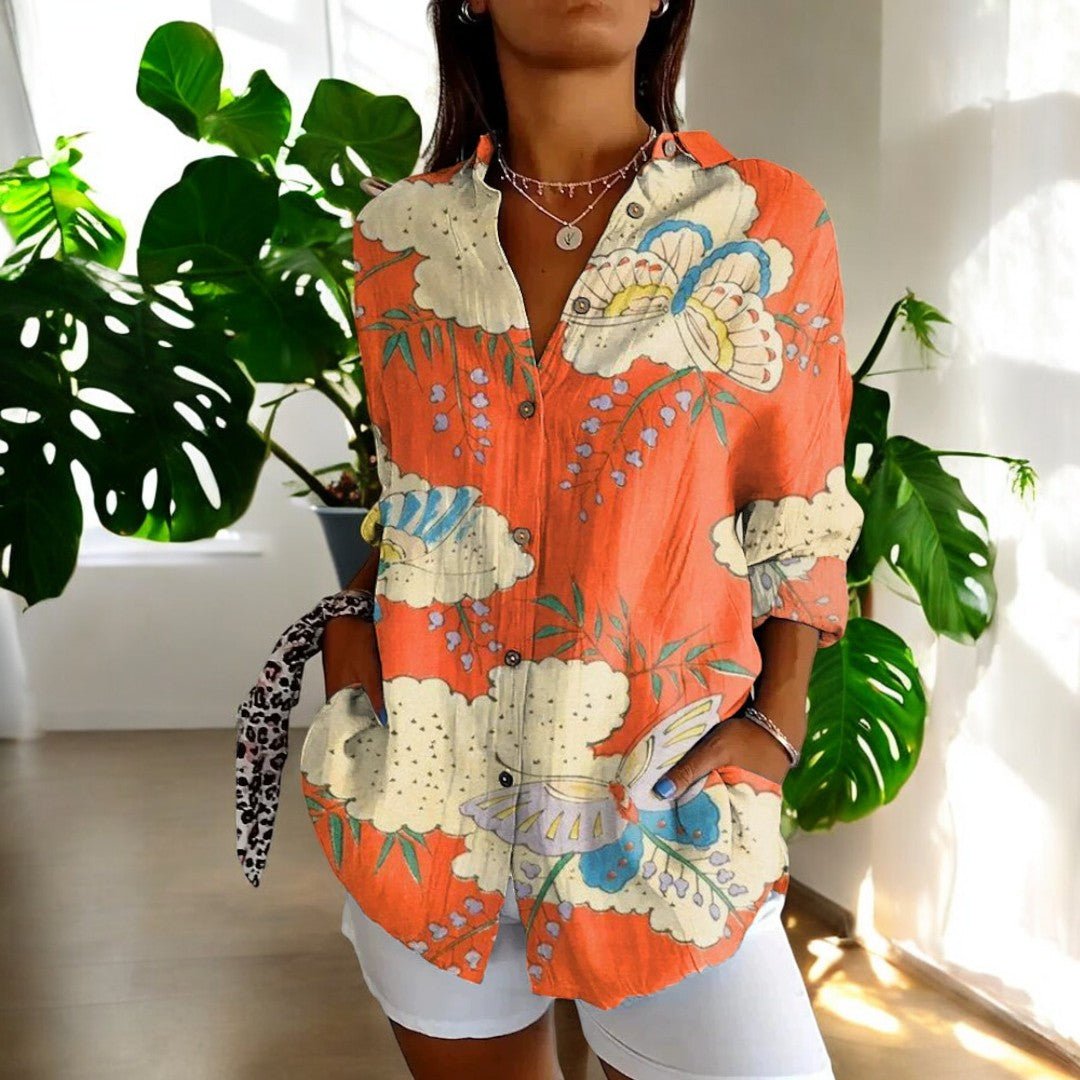 Stylish women's elegant blouse featuring a beautiful vintage floral print. Timeless and versatile.