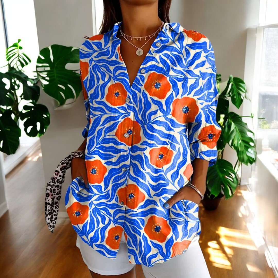 Classic women's elegant floral vintage blouse. Comfortable, versatile, and a timeless fashion piece.
