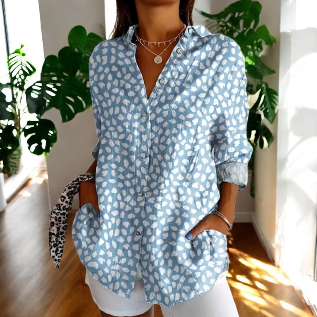 Exquisite floral print on an elegant vintage women's blouse. Comfortable & a classic fashion statement.