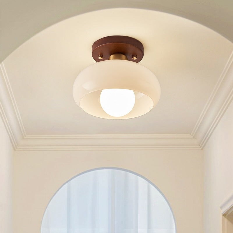 Atmospheric French Bauhaus ceiling light with wood, ideal for warm living room or bedroom lighting.
