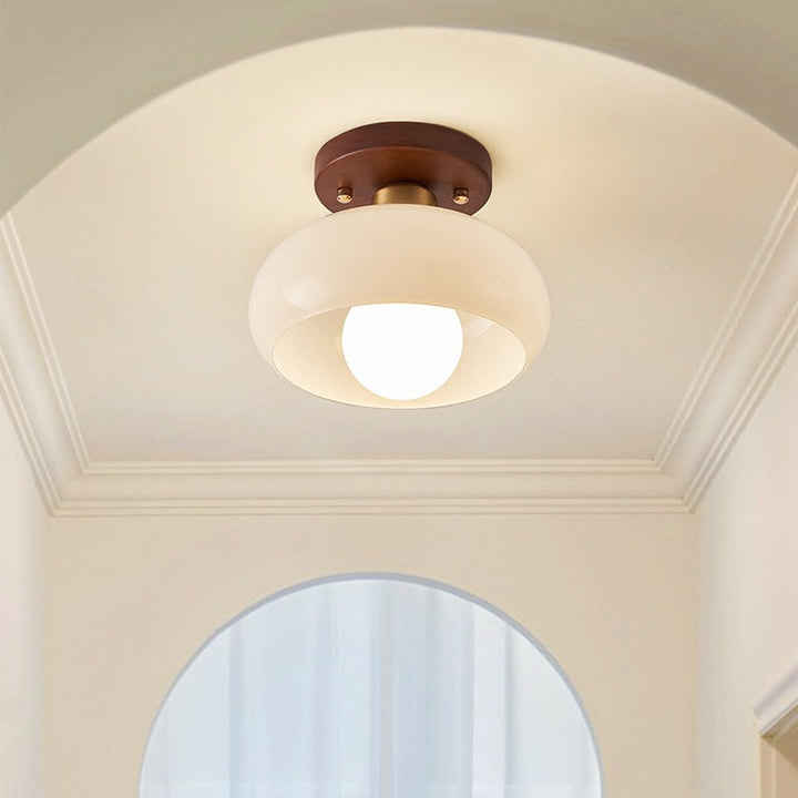 Atmospheric French Bauhaus ceiling light with wood, ideal for warm living room or bedroom lighting.