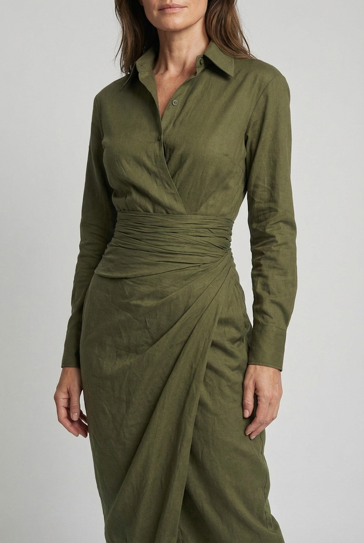 Sophisticated women's long sleeve wrap midi dress featuring ruched detailing & asymmetric skirt. Ideal for wedding guests.