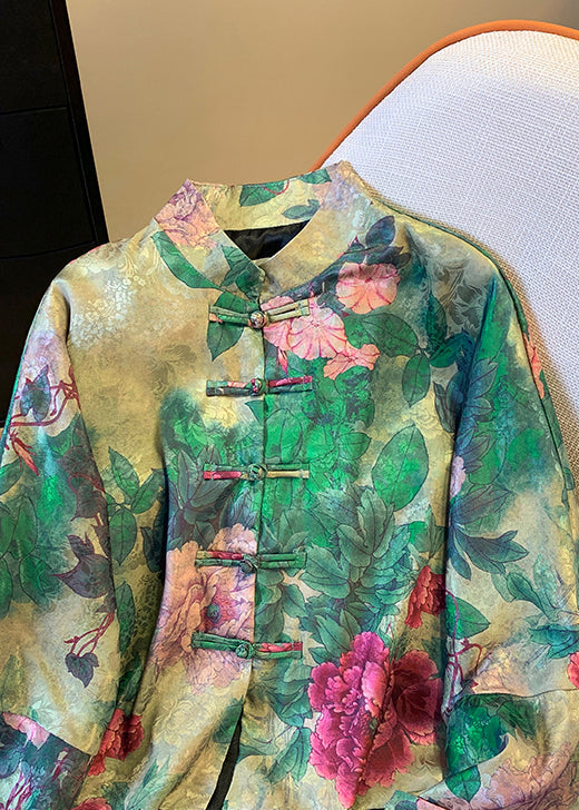 Fashionable green women's autumn jacket, an elegant button coat with a beautiful Chinese print for unique style.