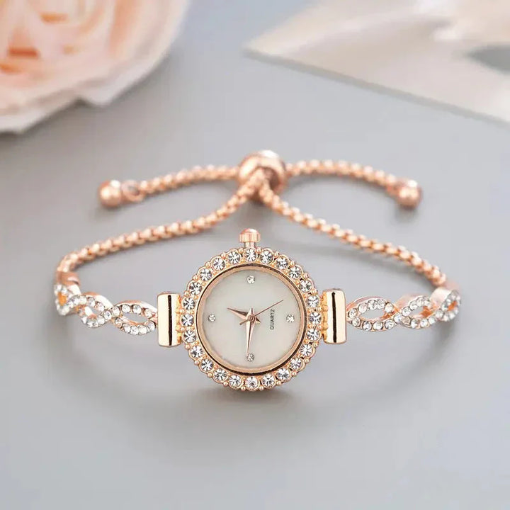 Elegant ladies' rose gold bracelet watch with dazzling crystal accents, perfect for luxury fashion.