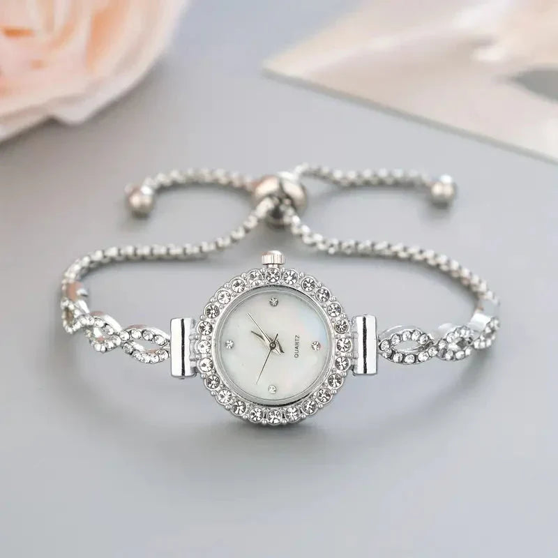Luxury ladies' gold watch with crystal details, a sophisticated bracelet design ideal as a gift for her.