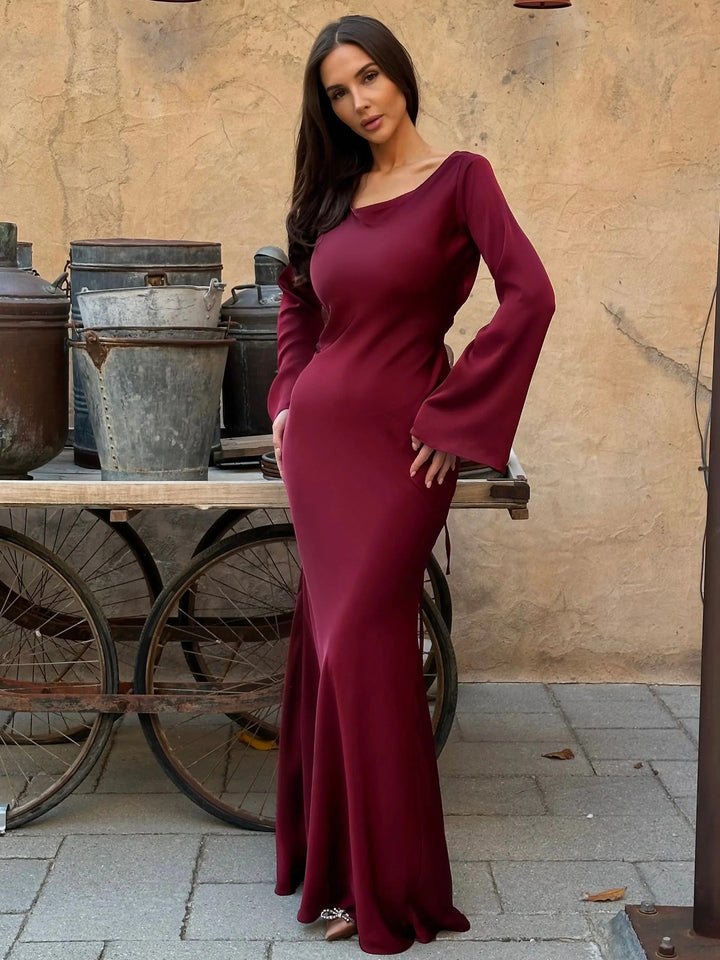 Refined women's long sleeve maxi dress. Sophisticated floor-length evening gown for elegant special occasions.