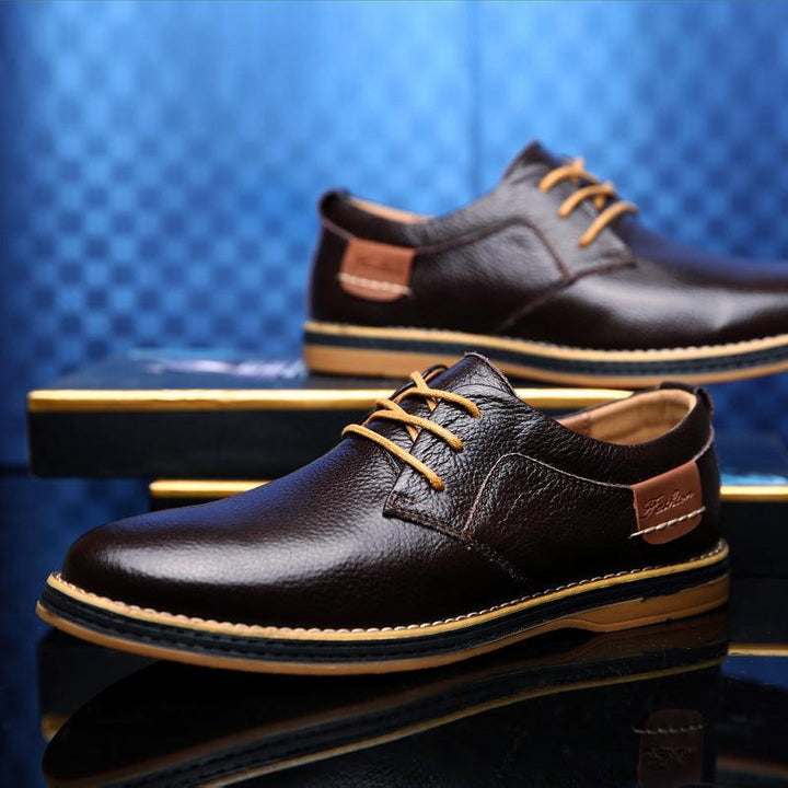 "Elegant men's premium leather Oxford dress shoes, classic formal wear with polished look, ideal for business attire."