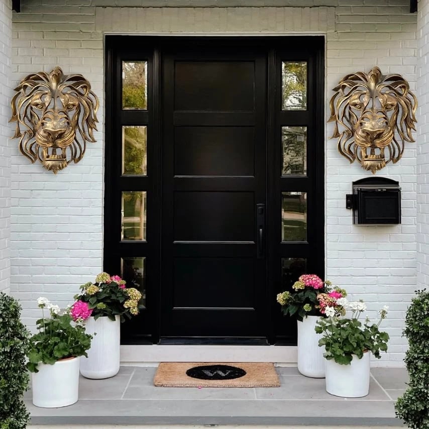 Versatile metal lion head wall decor, an elegant, strong art piece for home or garden enhancement.