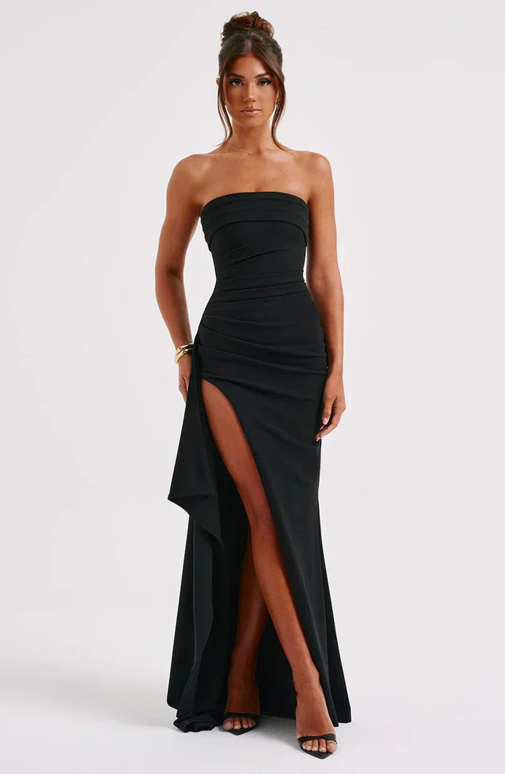Women's elegant evening maxi dress. Off-shoulder design with a stylish twisted detail, suitable for formal occasions.