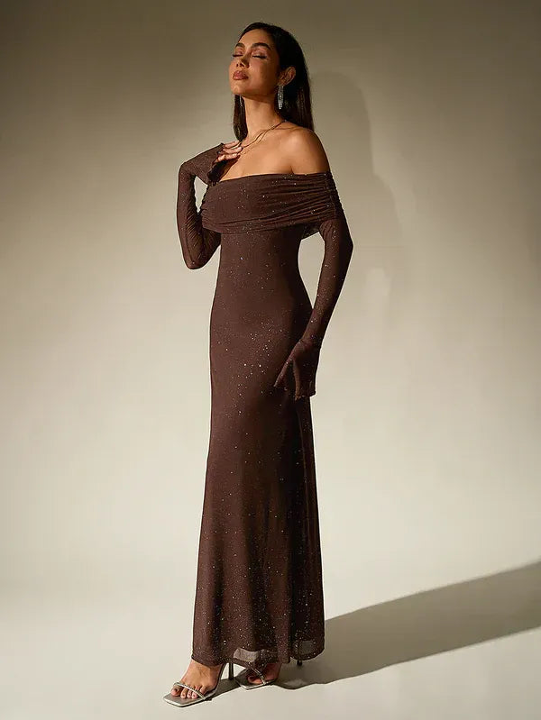Glamorous women's off-shoulder maxi dress. Fitted sheath evening gown with long sleeves, ideal for wedding guests.