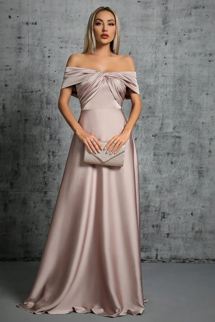 Wedding guest off-shoulder maxi dress, featuring a chic twisted knot and pleats.