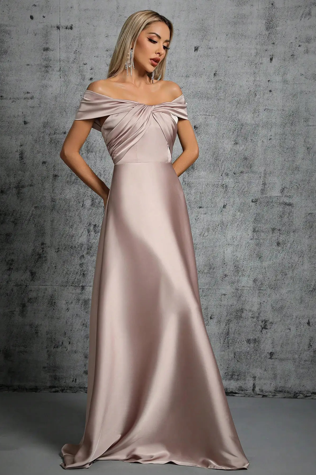 Orange women's maxi dress, off-shoulder style with a delicate twisted knot detail.
